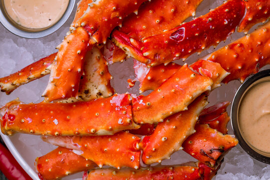 King crab claws on wooden table