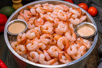 boiled shrimp on ice on dark blue table