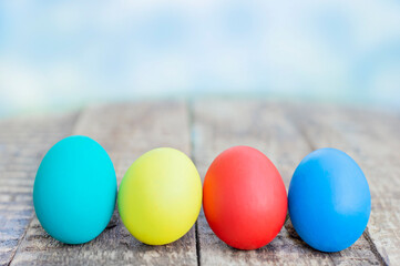 colorful easter eggs on wooden background with copy space. Easter background