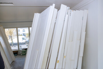 Interior wooden stacker door installation apartment building, wait installation for preparation of interior in new home