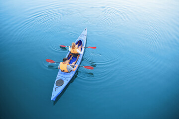 People kayaking in river, top view