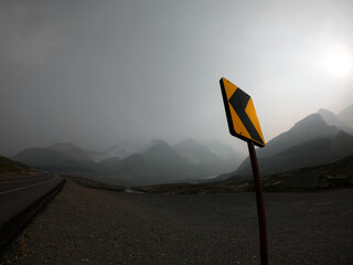 View of a sign in a foggy day at the Canadian Rockies