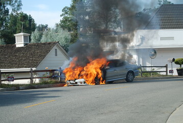 Vehicle in flames in a residential street