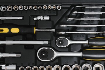 Fototapeta premium Set of assorted work carpentry and locksmith tools on a dark wooden background with copy space.