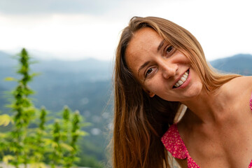 Girl and wild hemp bush