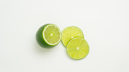 Ripe green lime citrus lime slice on white background.