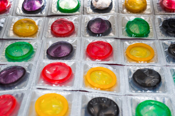 Colorful condoms background.