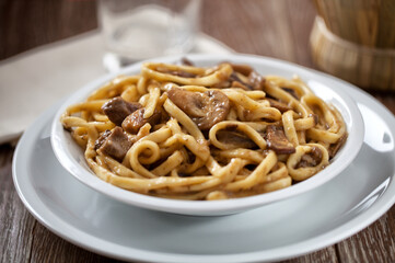 Tagliatelle with mushrooms on a plate. High quality photo.