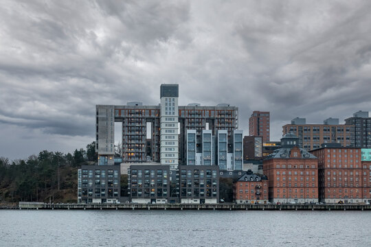 Winter cityscape of new exclusive futuristic residential apartment buildings by the water in Stockholm Sweden.