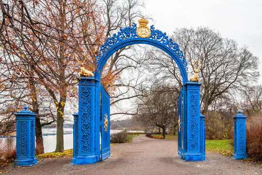 Beautiful vintage blue steel iron gate entrance to the public park Djurgarden in Stockholm Sweden.