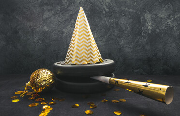 Heavy dumbbells weight plates with party hat and golden horn blower for New Year's Eve celebration....