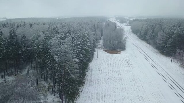 Winter forest nature snow-covered winter trees landscape early morning aerial view, railway tracks, railway. recreation travel and tourism frosty treetops bright colors aerial photography