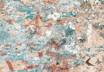 Colorful Distressed Plaster Wall With Graffiti Paint. Shabby Background Design. Abstract Grunge Urban Art Wallpaper. Peel Plaster Many Layers Cracked Wall.