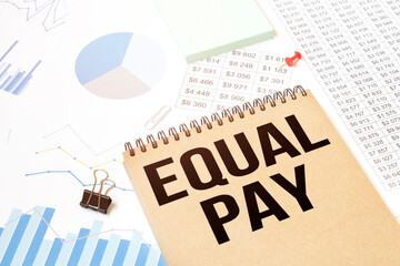 Notepad with text Equal Pay. Diagram and white background