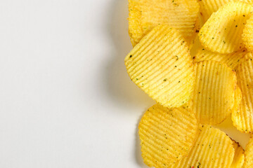 One of the types of snacks, fast food, junk food - ruffled potato chips on a white background....
