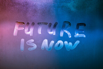 words future is now handwritten on night wet window glass surface