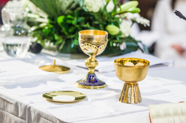 altar with host and chalice with wine in the churches of the pope of rome, francesco