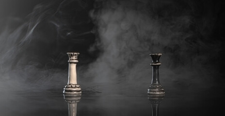 Chess figures battle, surrounded by smoke
