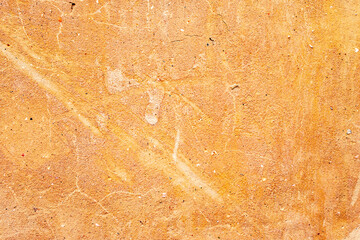 Texture of a concrete wall with cracks and scratches which can be used as a background