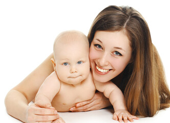 Portrait of happy smiling mother and baby playing together over a white background