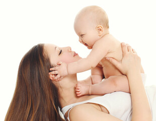 Happy smiling mother and baby playing together over a white background