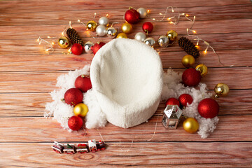 baby seat for newborn photo shoot. Christmas balls and highlights