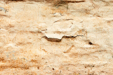 Texture of a brick wall with cracks and scratches which can be used as a background
