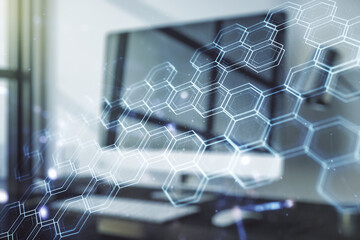 Creative concept of wireless technology with hexagon hologram on modern laptop background. Big data and database concept. Multiexposure