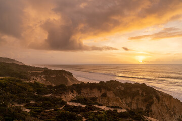 beautiful sunset with beach and sand dunes on the Alentejo coast of Portugal