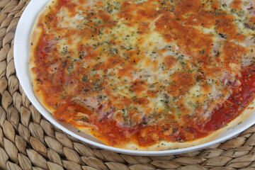 italian pizza with ham tomato and mozarella