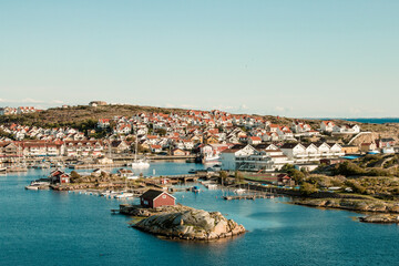 Fototapeta premium Swedish small harbour town with red houses in sea bay
