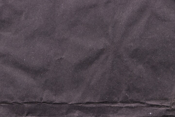 Crumpled old black paper. Empty background.