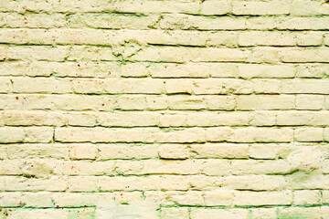 Texture of a brick wall with cracks and scratches which can be used as a background