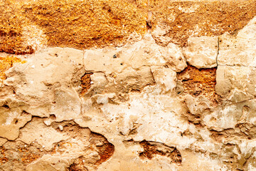 Texture of a brick wall with cracks and scratches which can be used as a background