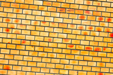 Texture of a brick wall with cracks and scratches which can be used as a background