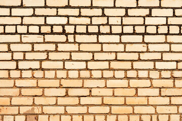 Texture of a brick wall with cracks and scratches which can be used as a background