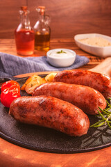 Pork sausage roasted in an iron frying pan - Close up