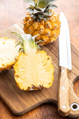 Ripe baby pineapple. Halved mini pineapple.