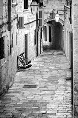 Cityscape, in black-and-white color - view of a early morning medieval street in the Old Town of Dubrovnik on the Adriatic Sea coast of Croatia