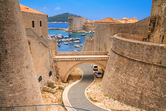 Summer cityscape - view of the bridge between the Revelin Fortress and the Ploce Gate in the Old Town of Dubrovnik on the Adriatic coast of Croatia