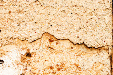 Texture of a concrete wall with cracks and scratches which can be used as a background