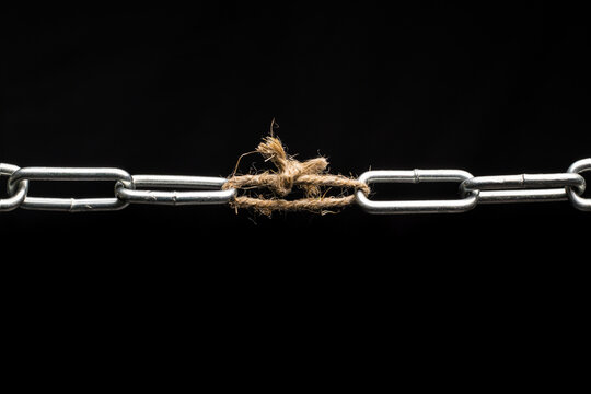 The chain is tied together with a rope. Weak link in the chain.