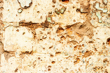 Texture of a brick wall with cracks and scratches which can be used as a background