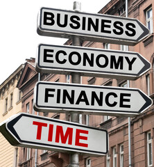 The road indicator on the arrows of which is written - business, economics, finance and TIME