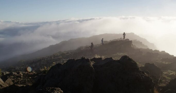 Tourist enjoying scenic view at top of Haleakala Crater on Maui