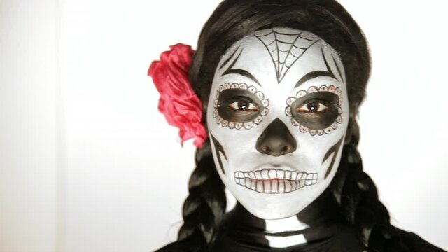 Woman wearing Day Of The Dead skeleton makeup