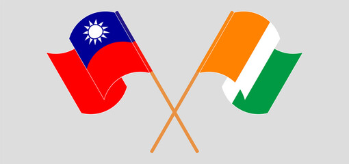 Crossed and waving flags of Taiwan and Republic of Ivory Coast