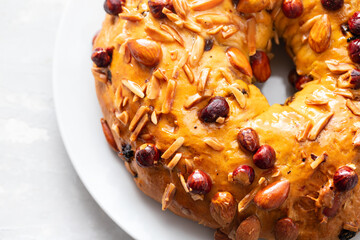 typical portuguese fruit cake Bolo rainha on white dish