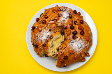 typical portuguese fruit cake Bolo rainha on white dish