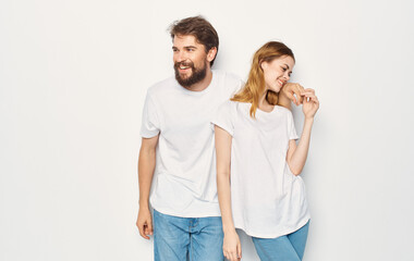 Cheerful man and woman t-shirts studio family lifestyle